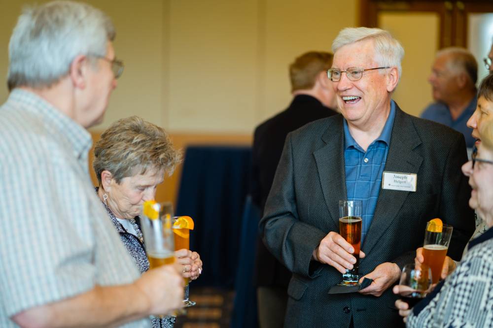 Guests laughing at the Retiree Reception.